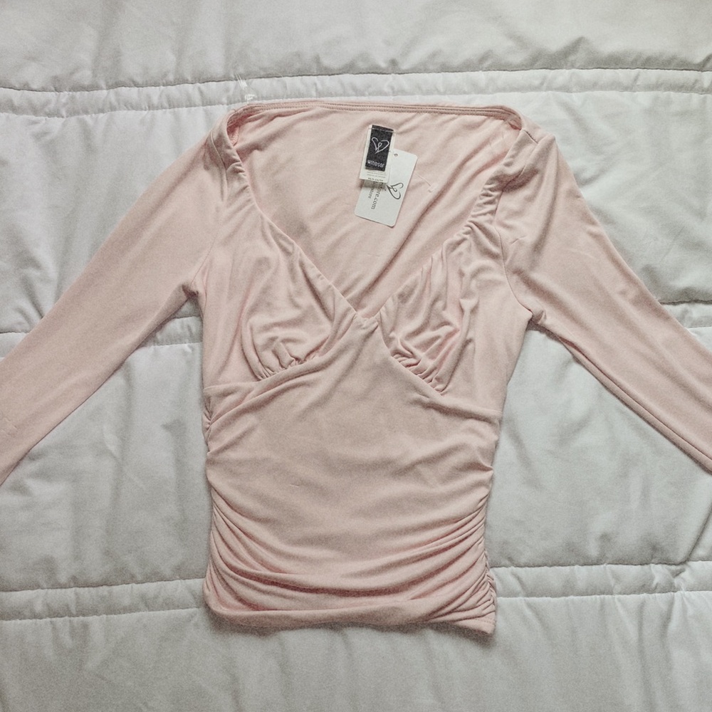 pink woman’s v cut long sleeve